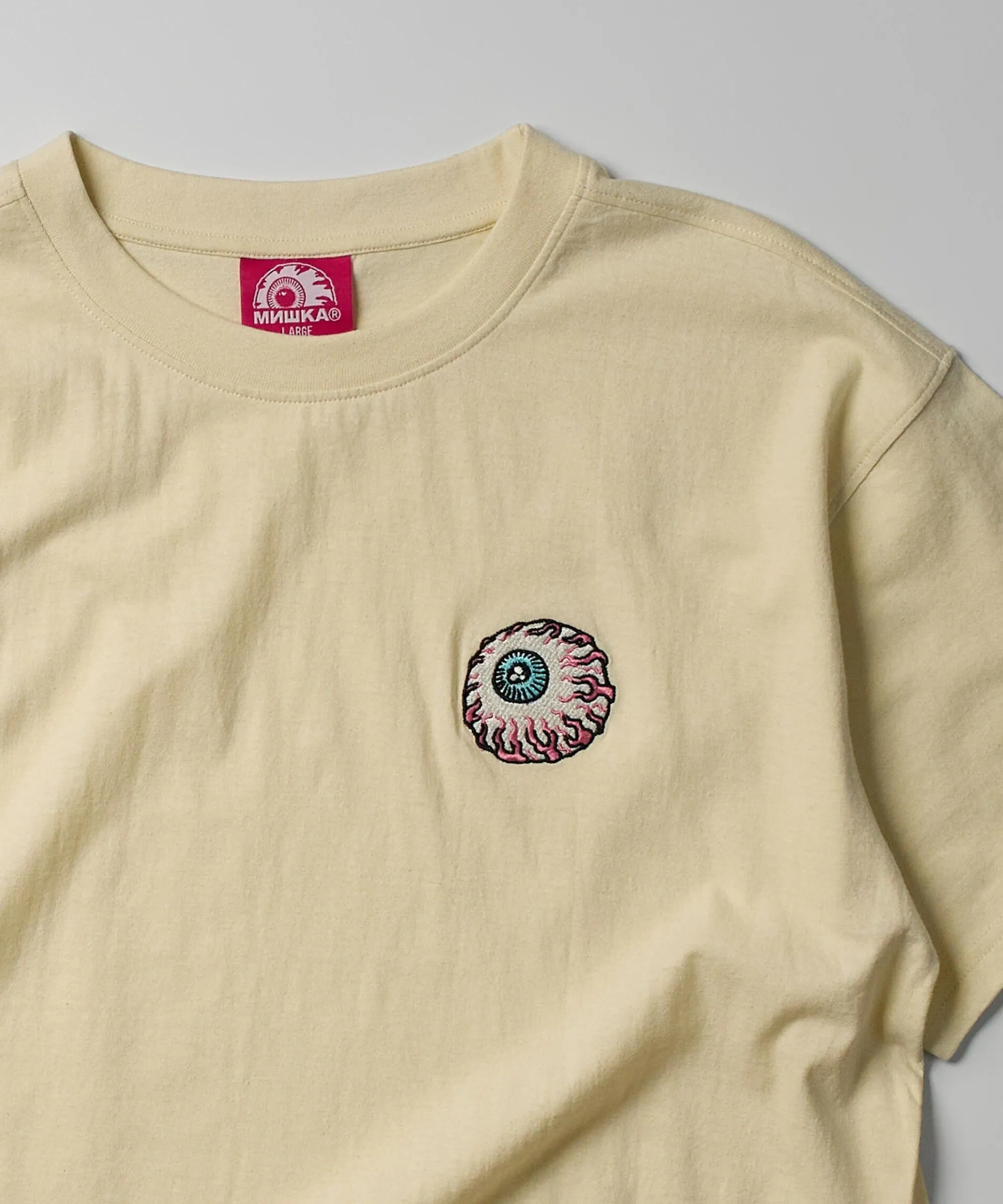mishka_embroidered_eyeball_short_sleeve_tee__sand_2.webp Flash Sale Mishka Embroidered Eyeball Short Sleeve Tee - Sand Graphic Tees