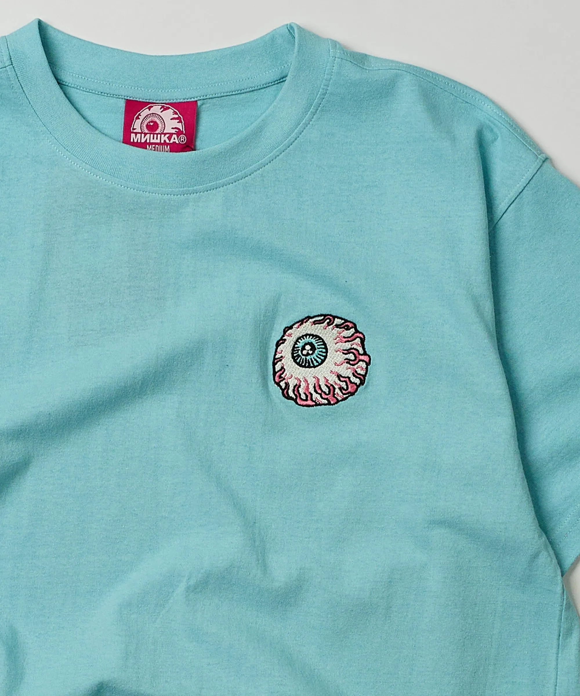 mishka_eyeball_embroidered_short_sleeve_tee__light_blue_2.webp Discount Mishka Eyeball Embroidered Short Sleeve Tee - Light Blue Graphic Tees